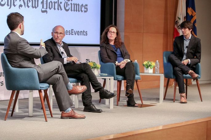 journalists seated on stage