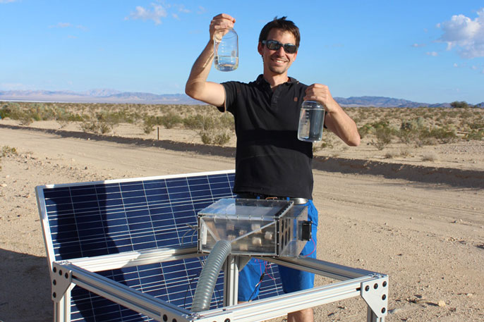 Mathieu Prévot displays water collected by the harvester