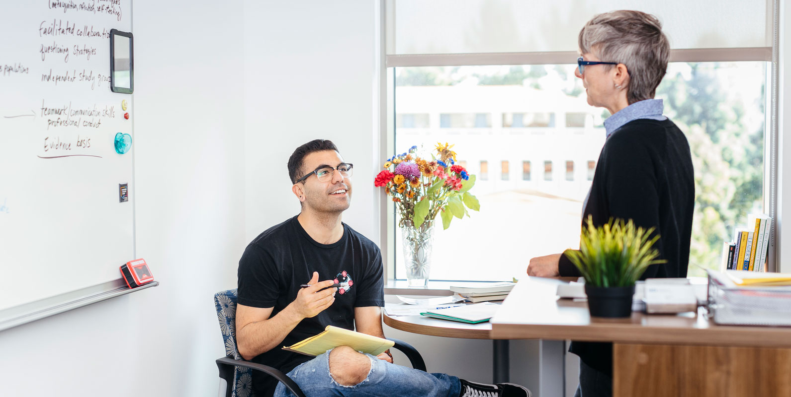 Student sitting in a professor's office