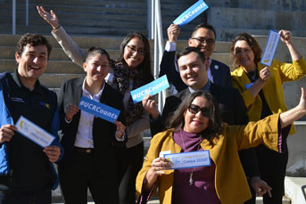 Associated Students of UC Riverside having fun with signs