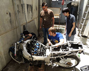 UCR students strip engine from motorcycle