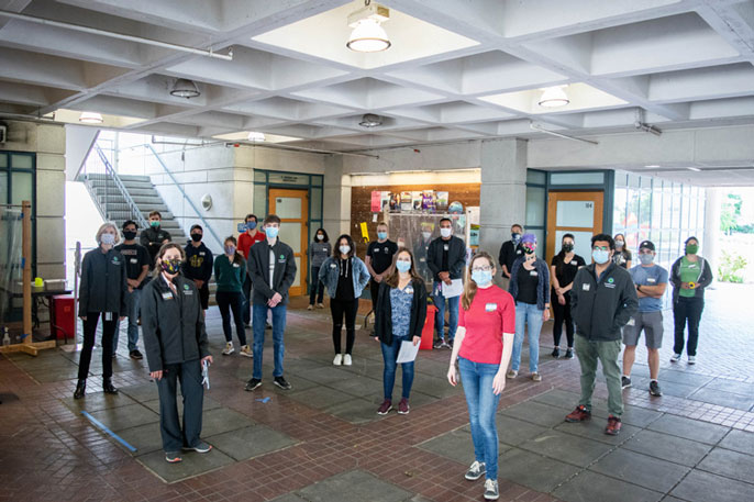 a large group of volunteers assisting in the study