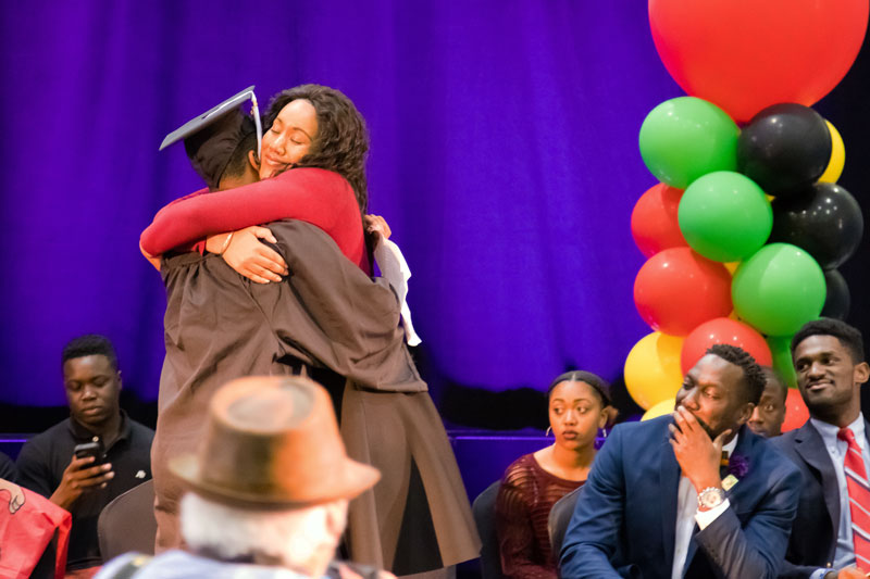 Sharee Hughes hugs a graduate