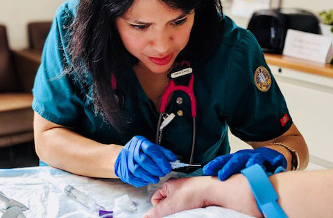 Silvia Arabia working with a patient