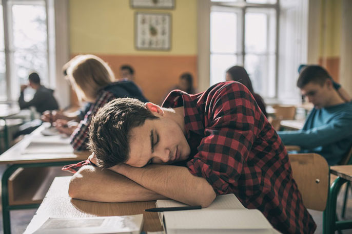 Student sleeping on desk