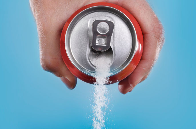 Sugar pouring out of a soda can