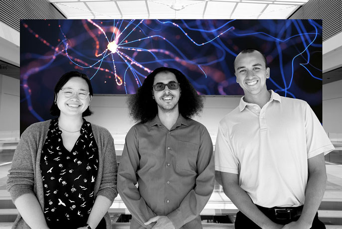 Three researchers who participated in the Bravo study side by side over a neuron background
