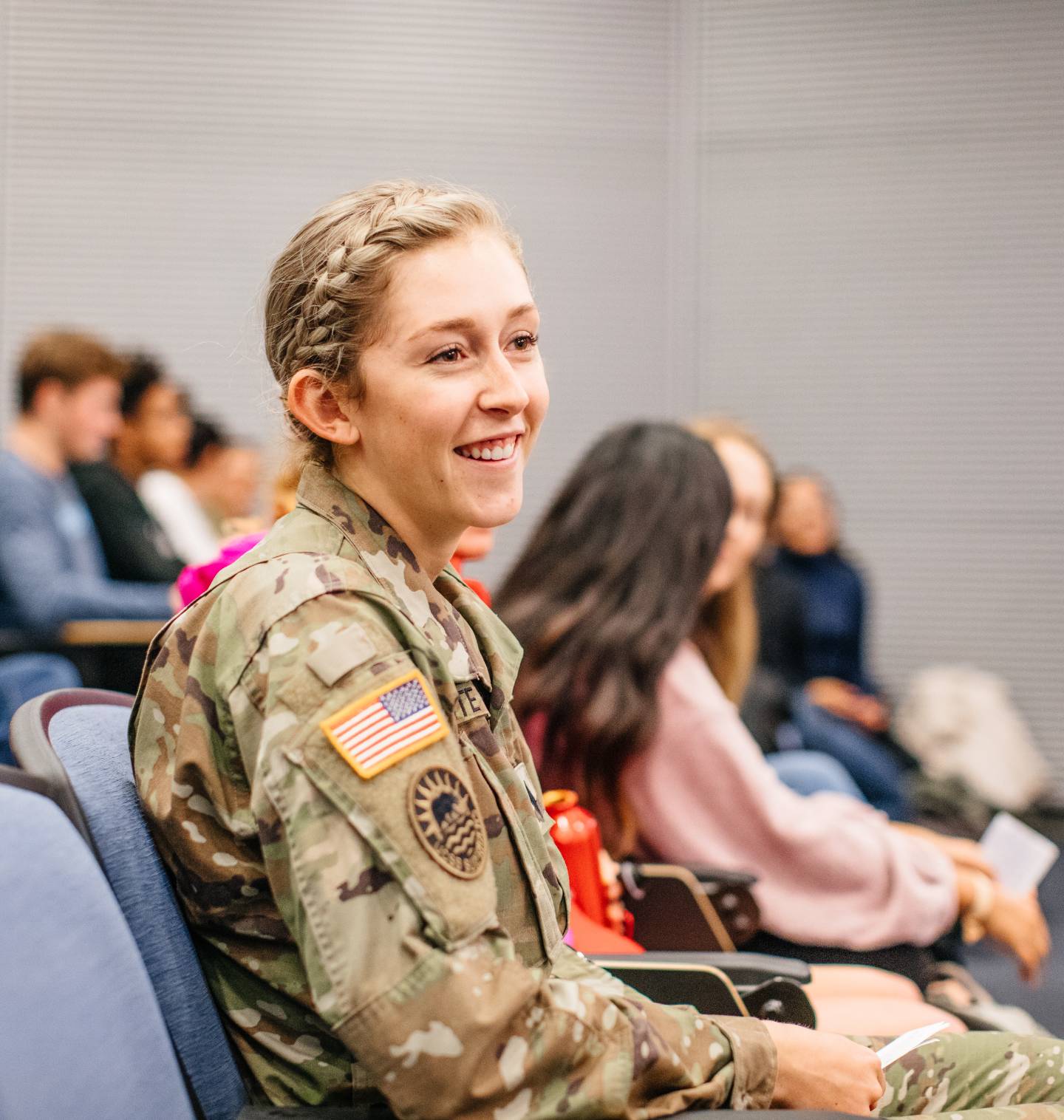 Student in classroom with army uniform