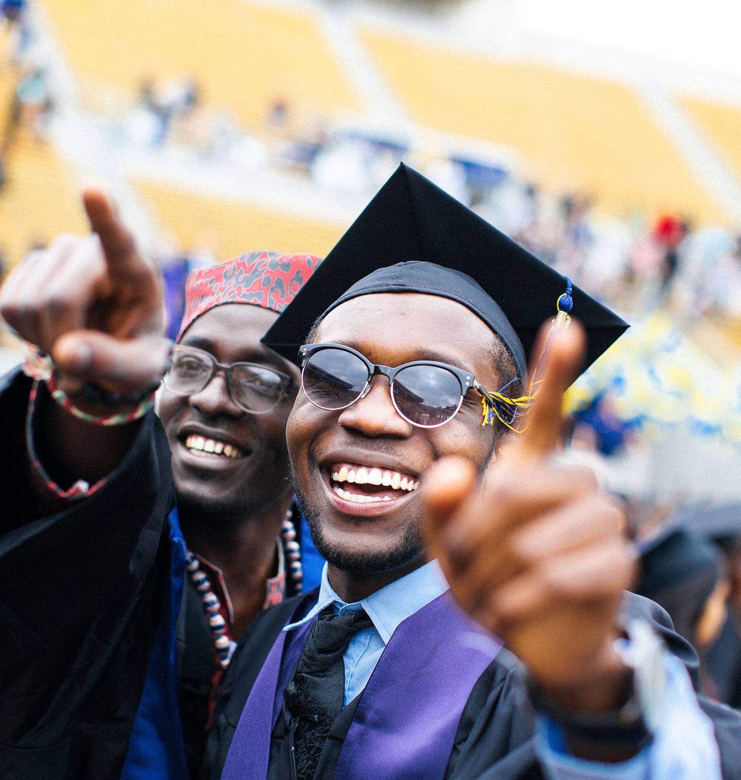 Two students smiling on graduation day