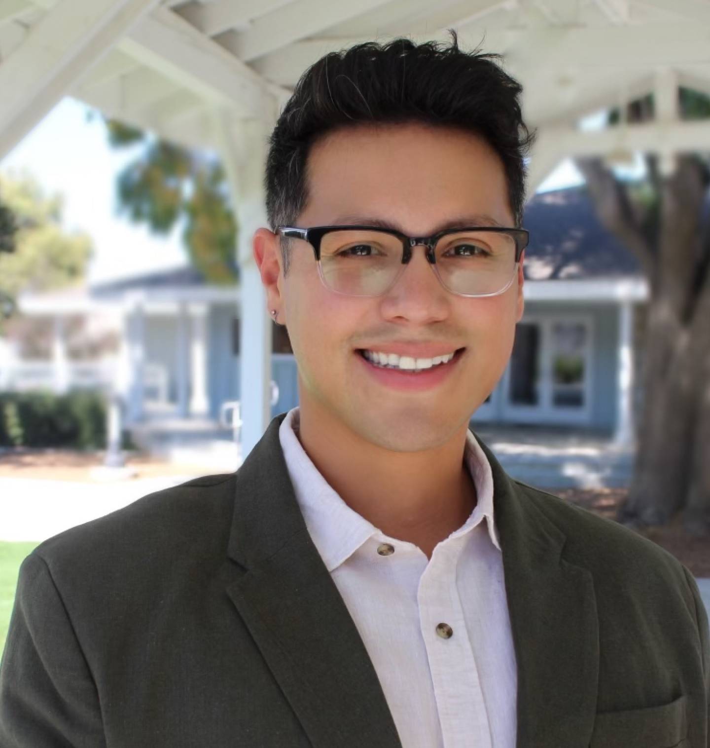 Young man with glasses smiling
