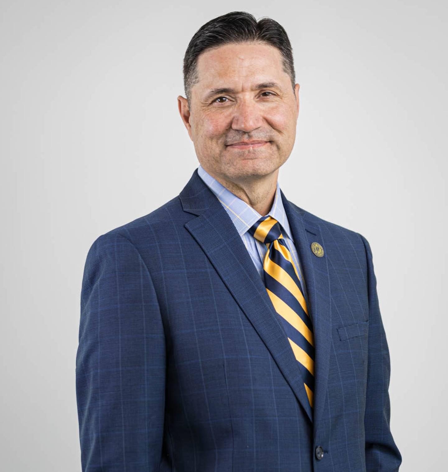 Chancellor Juan Sánchez Muñoz in a blue suit