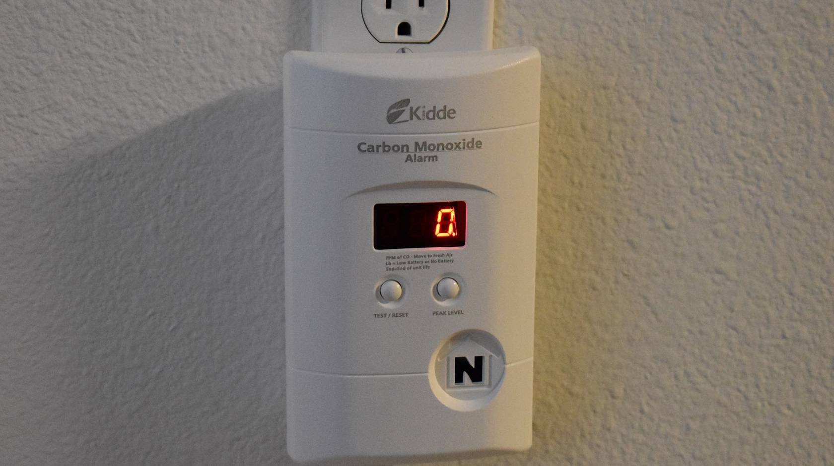 Carbon monoxide detector plugged into a wall outlet