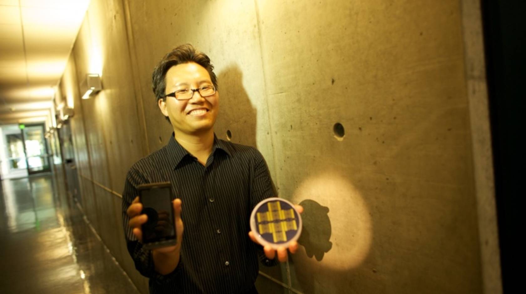 researcher holding prototypes