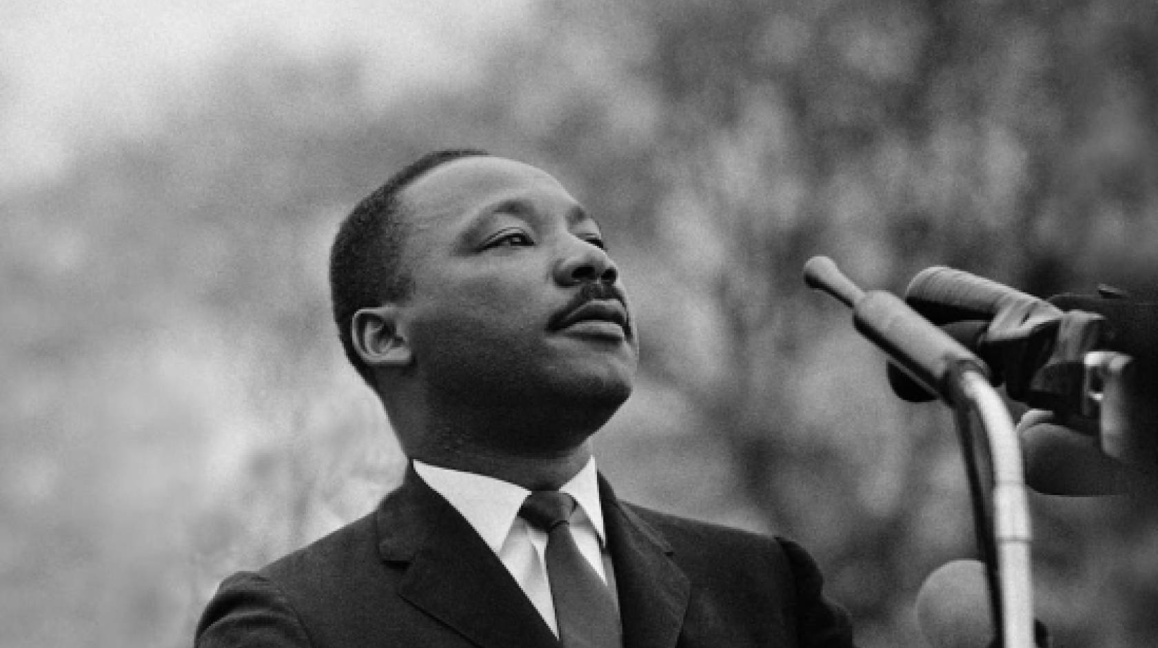 Martin Luther King Jr. at a microphone