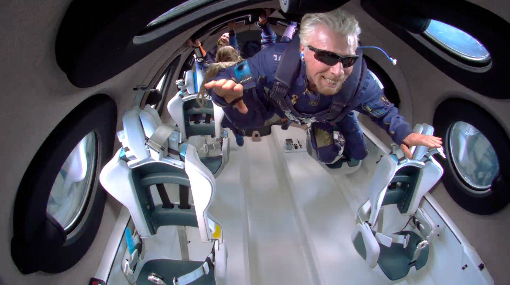 Sir Richard Branson is weightless in space on his Virgin Galactic passenger rocket plane.