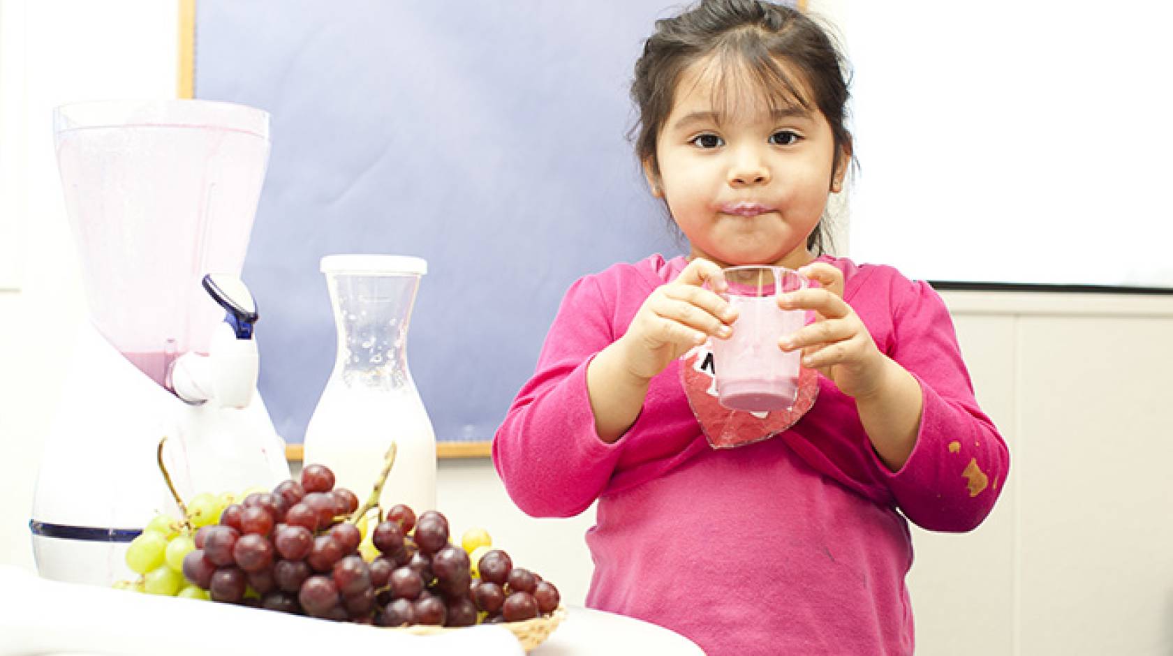 Girl holding fruit drink