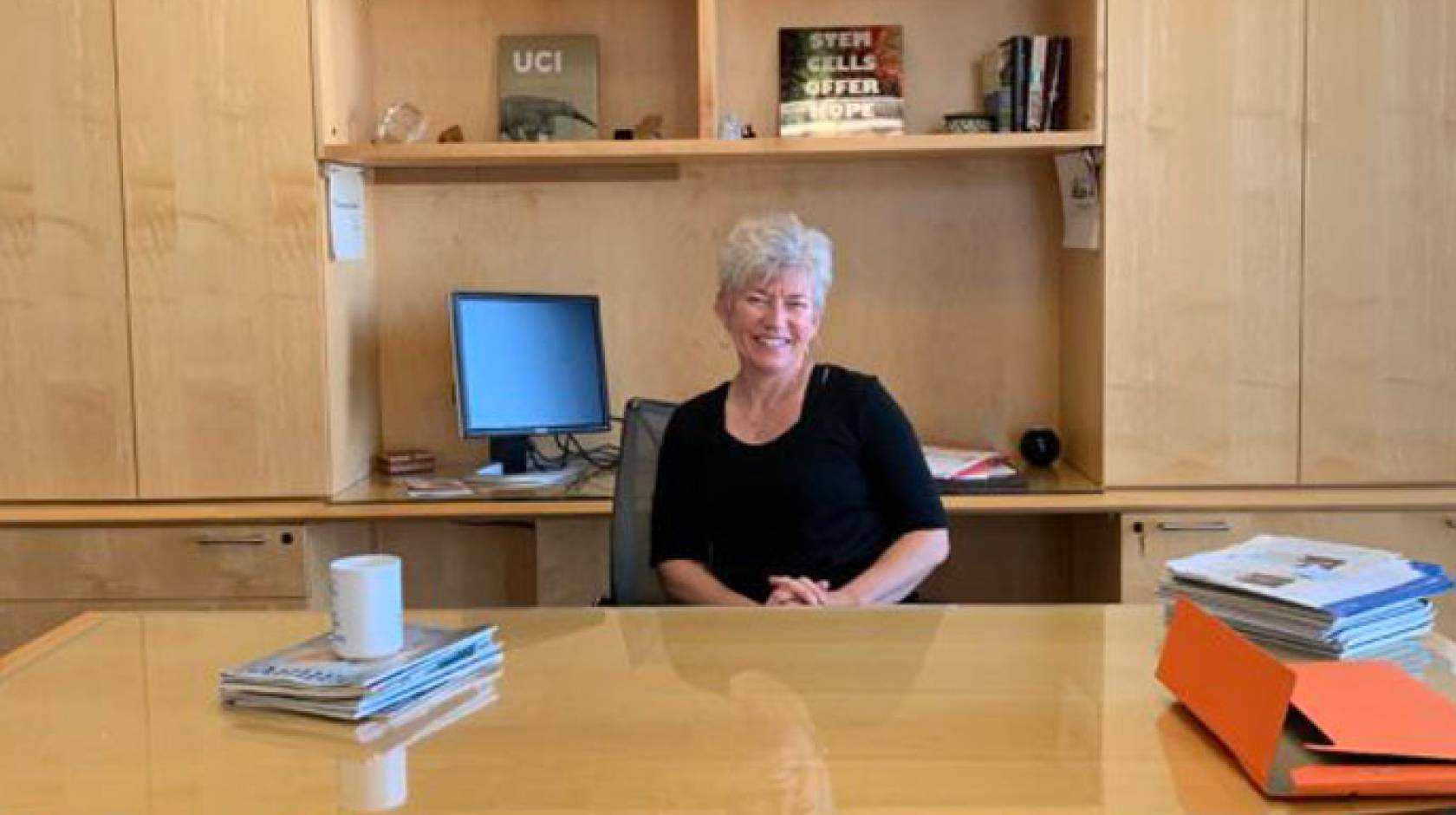 Aileen Anderson at her desk