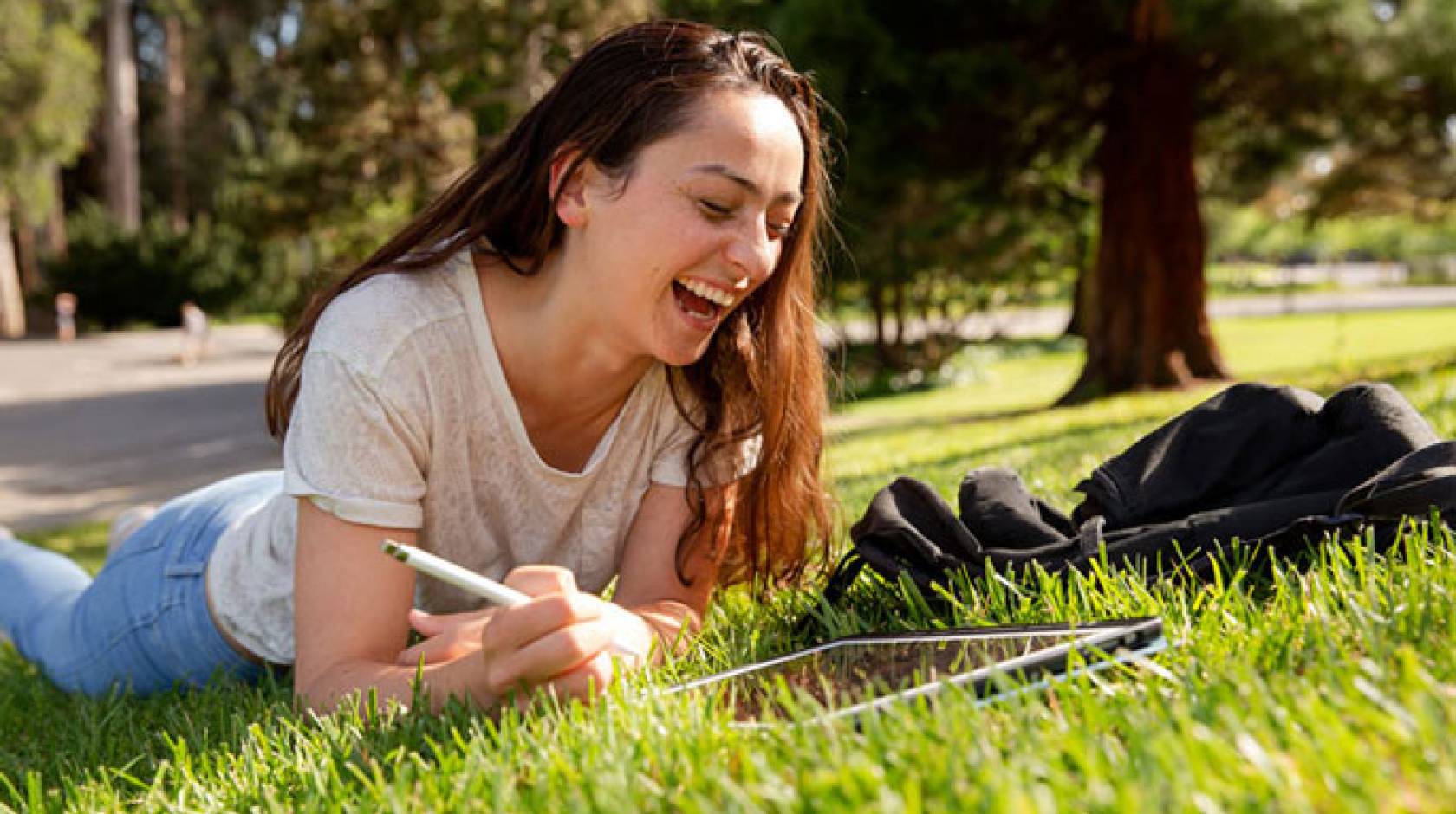 Anna Boser studying on the green