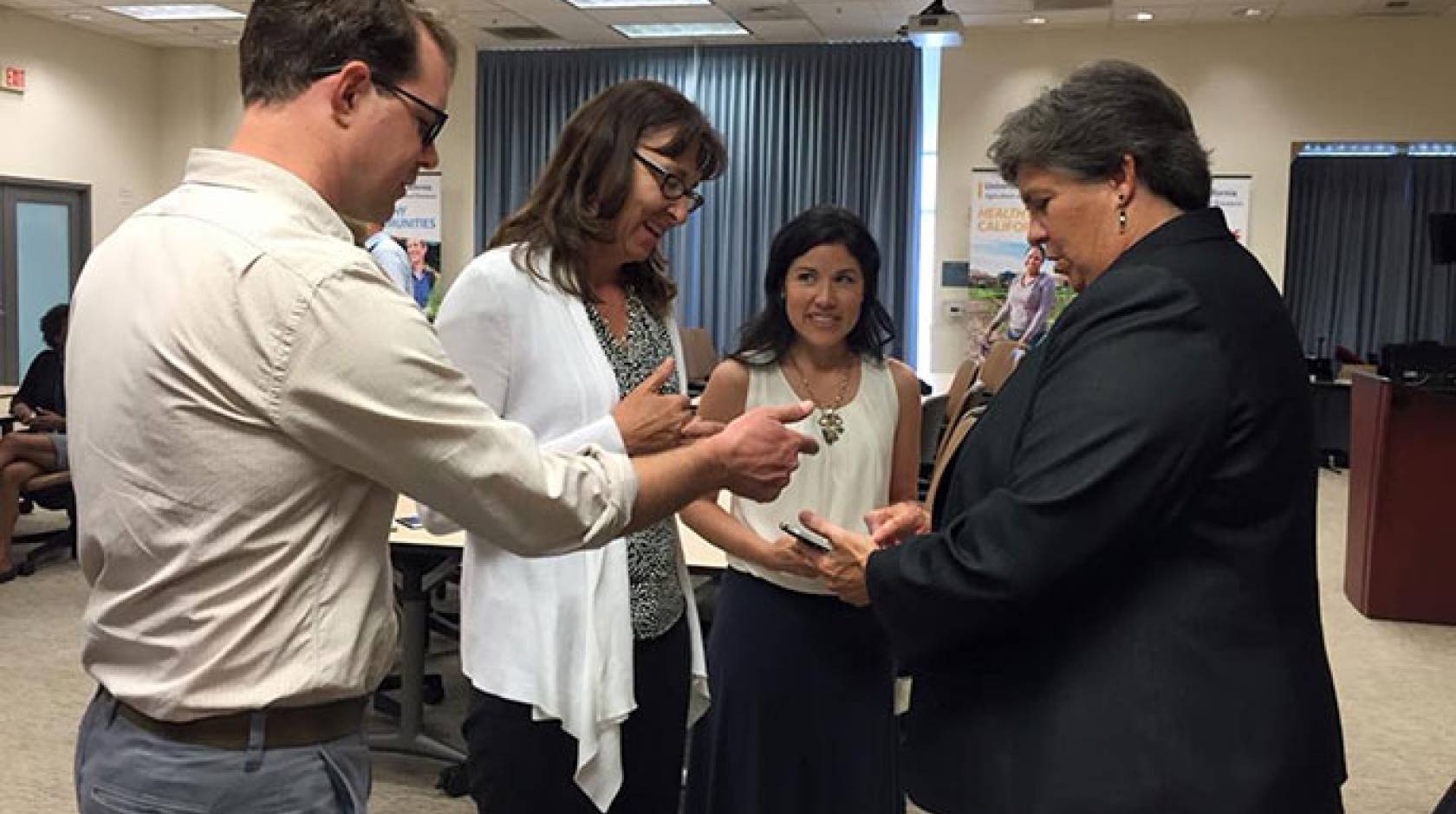 Glenda Humiston (right) at a reception with UC staff her first day with UC ANR. 