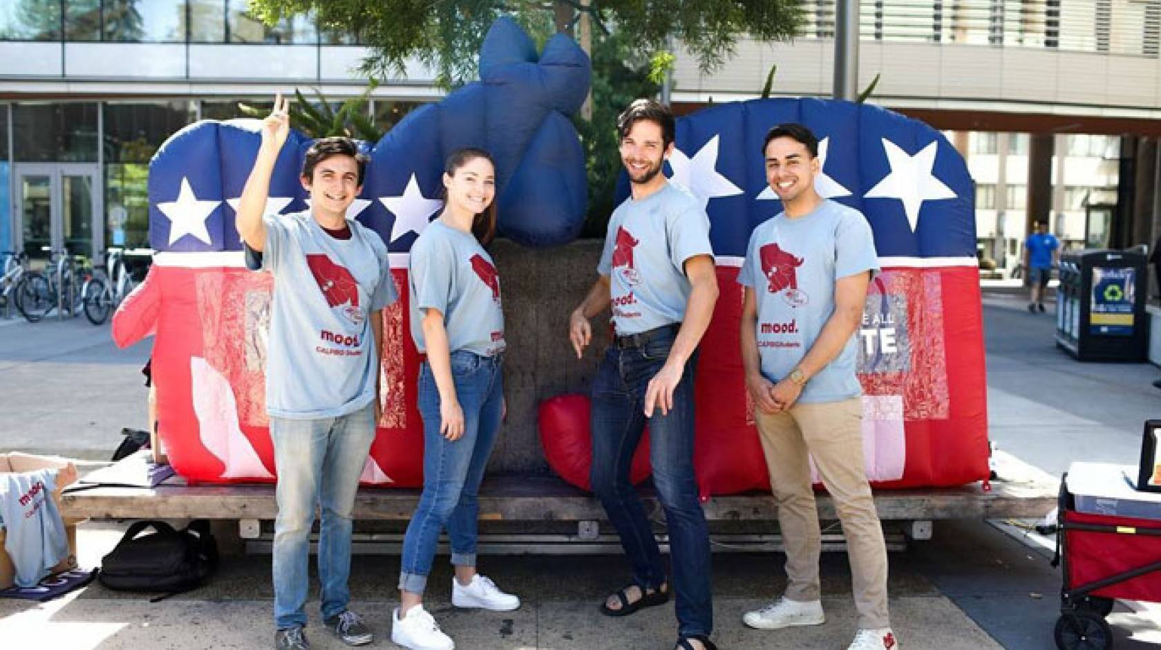 Students in front of the Democrat and Republican mascots in papier-mâché