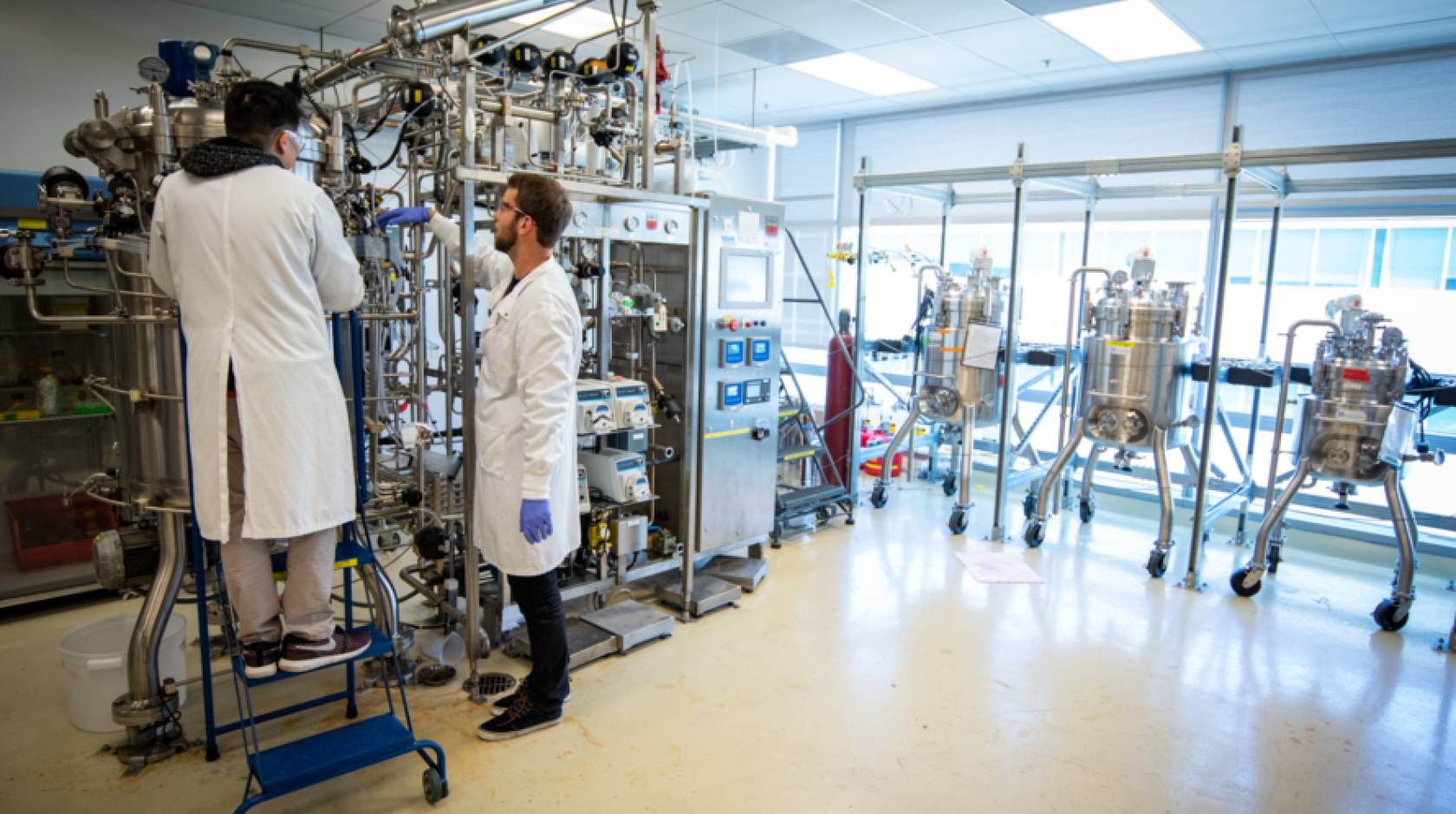 Two people working on a project in a lab