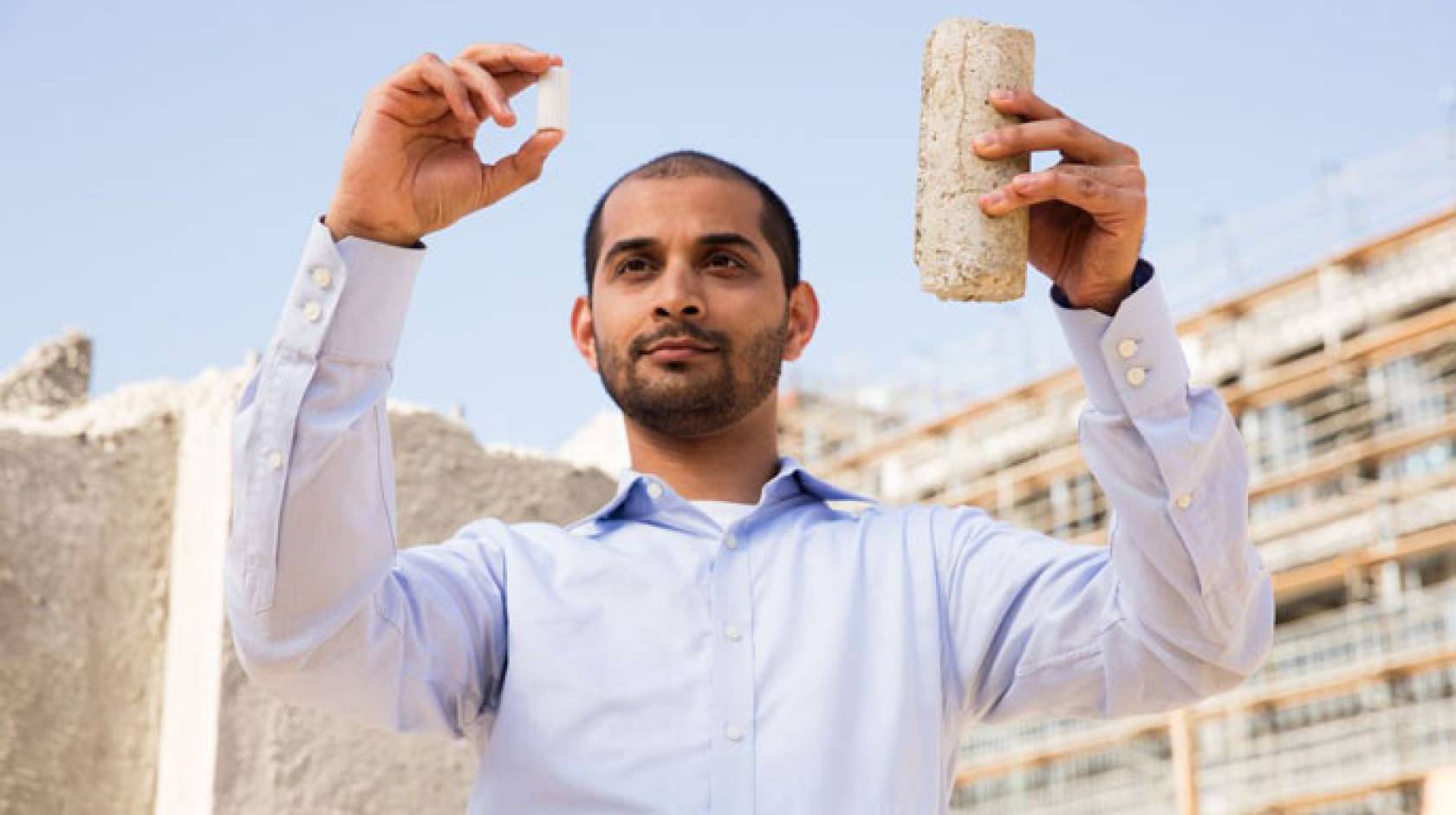 Gaurav Sant holding samples of concrete