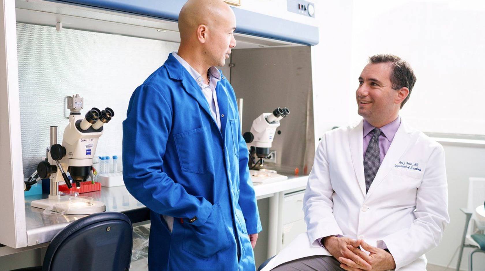 Two doctors talking to each other at UCSF