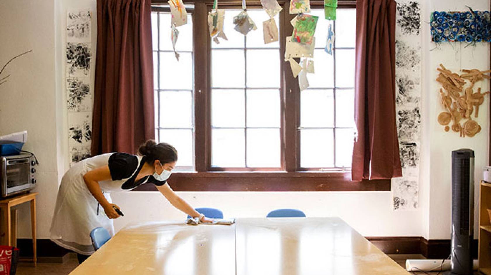 Woman cleaning child care facility