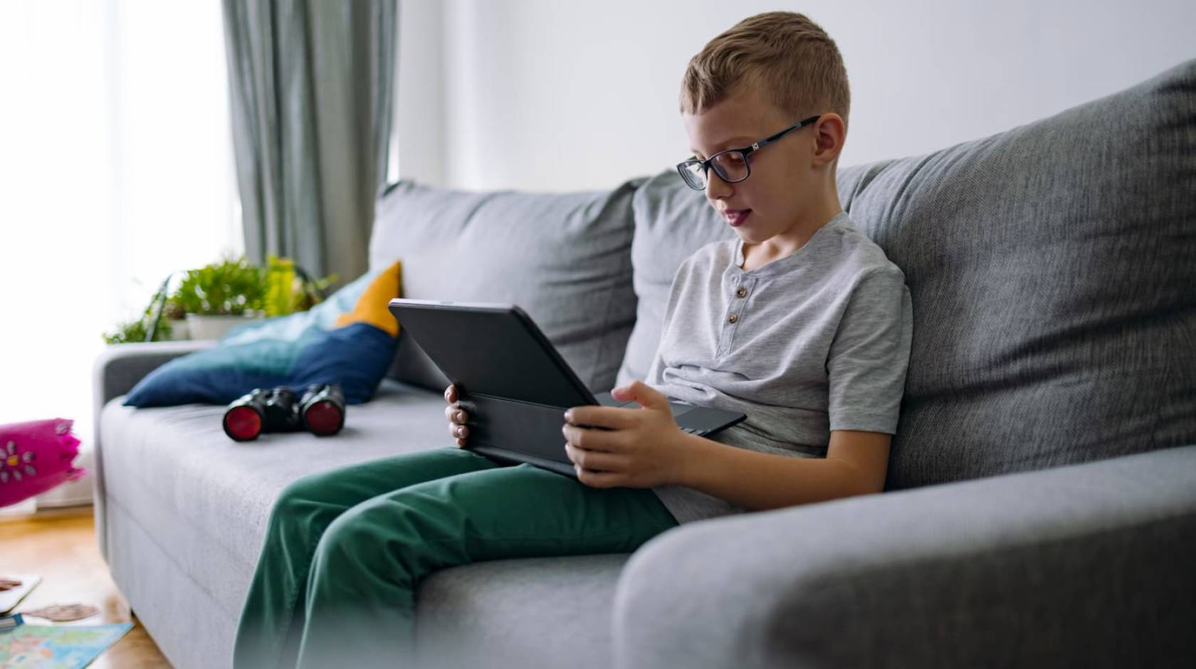 child looking at a tablet