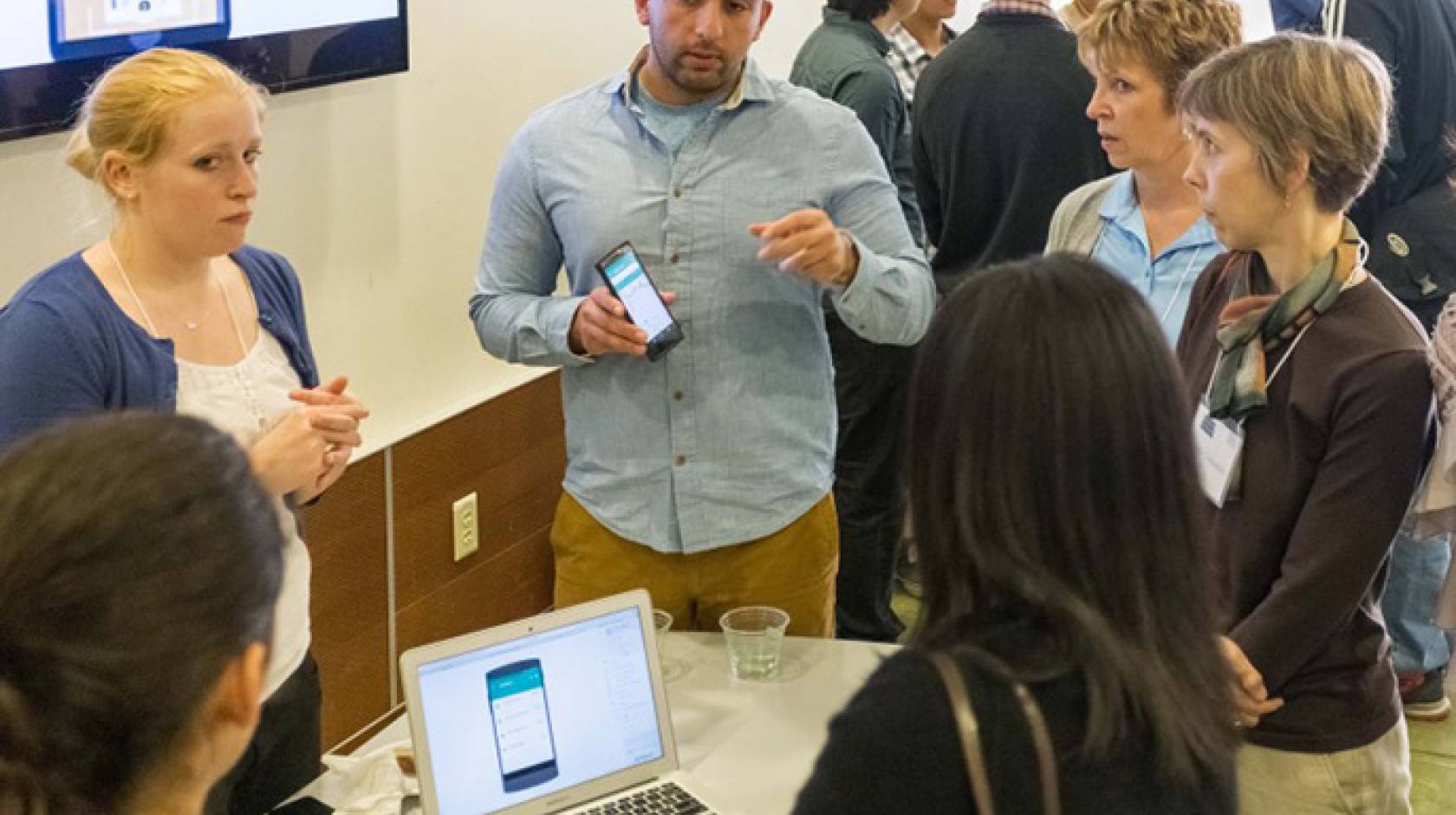 Members of Snapily explain their app at the CITRIS Mobile App Challenge at UC Berkeley.