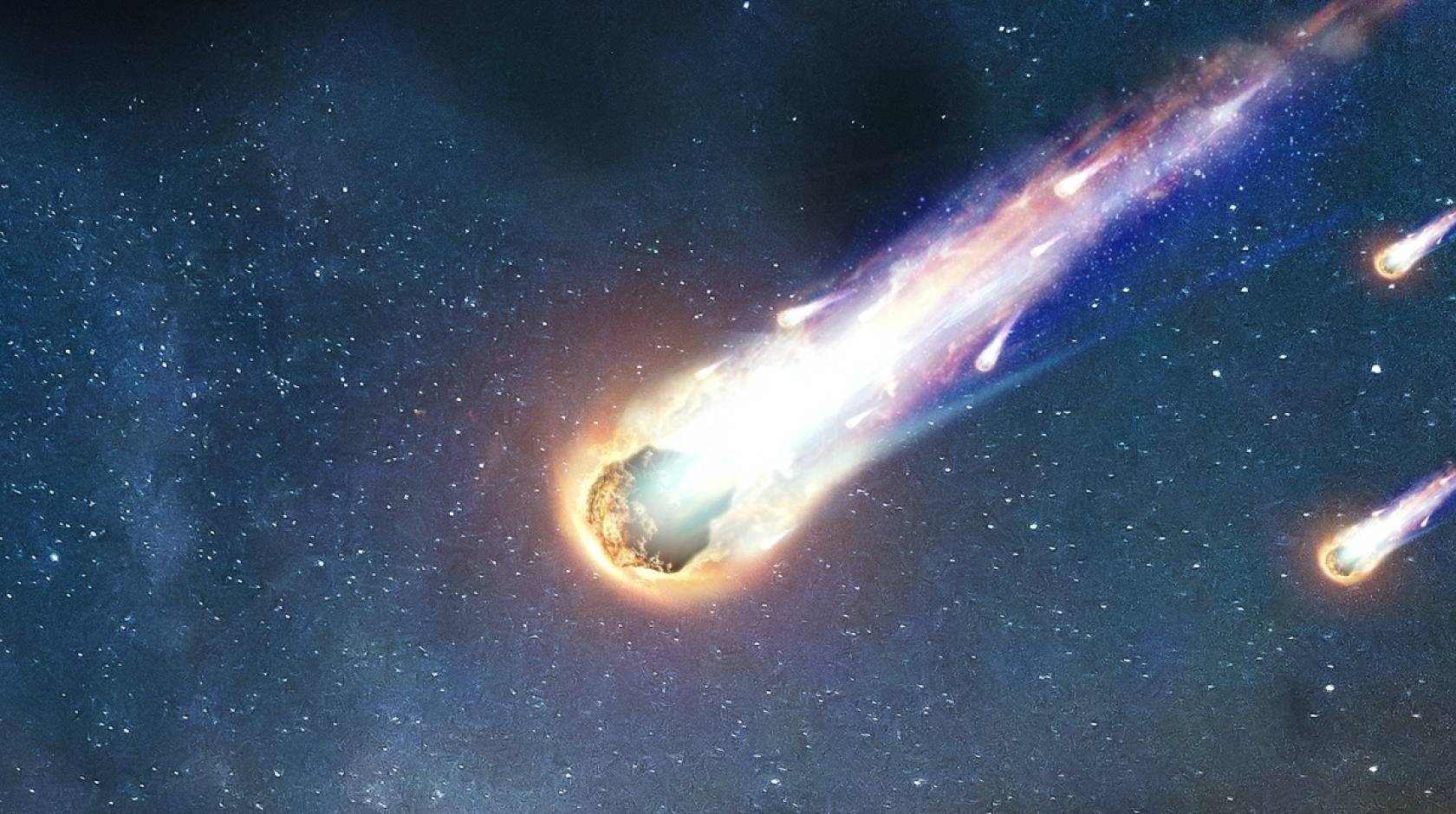 Realistic illustration of a comet with a colorful tail streaking through space, tailed by 2 smaller asteroids