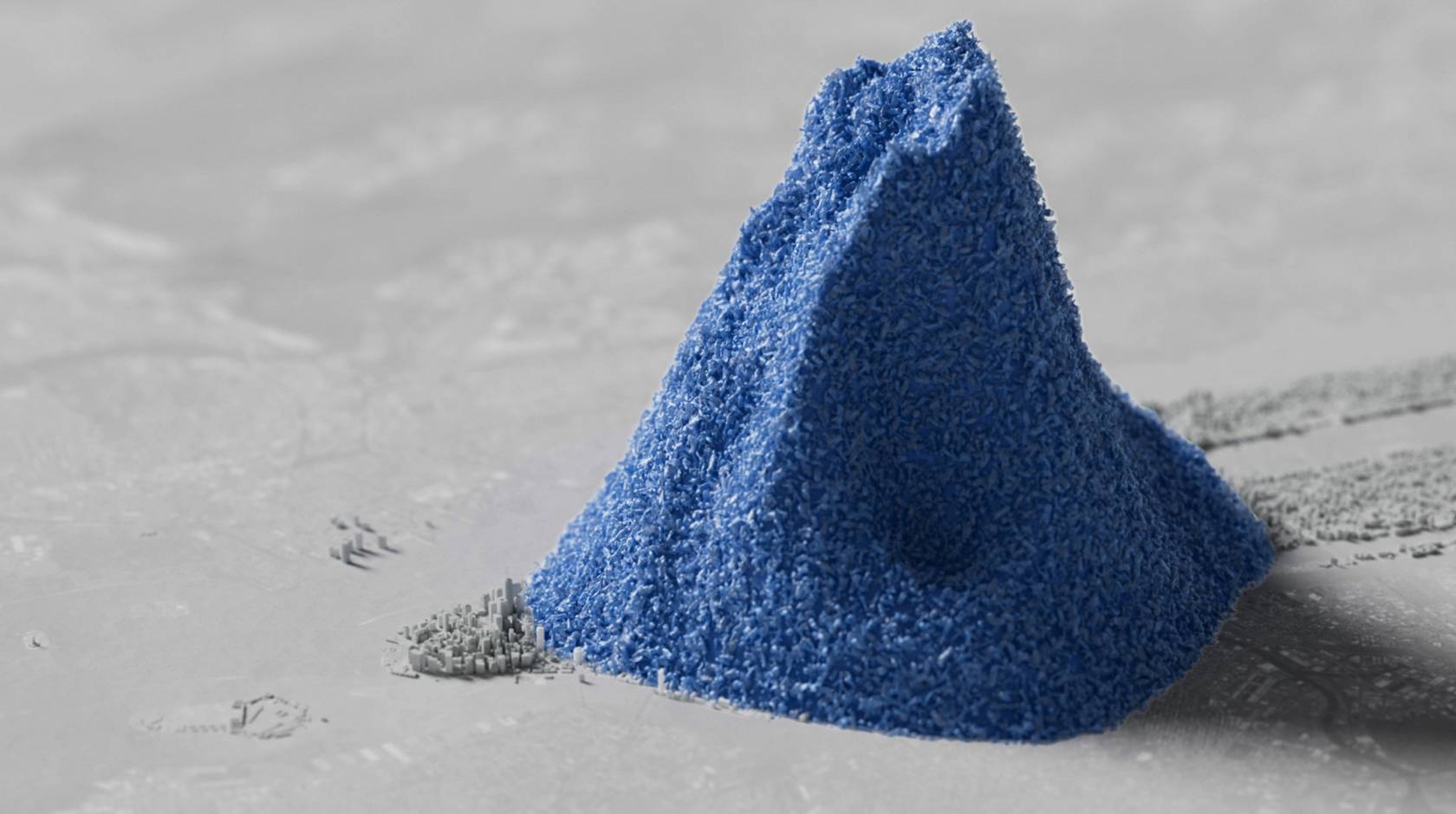 A computer-generated image of a pile of blue plastic beads dwarfing a colorless 3D rendering of Manhattan