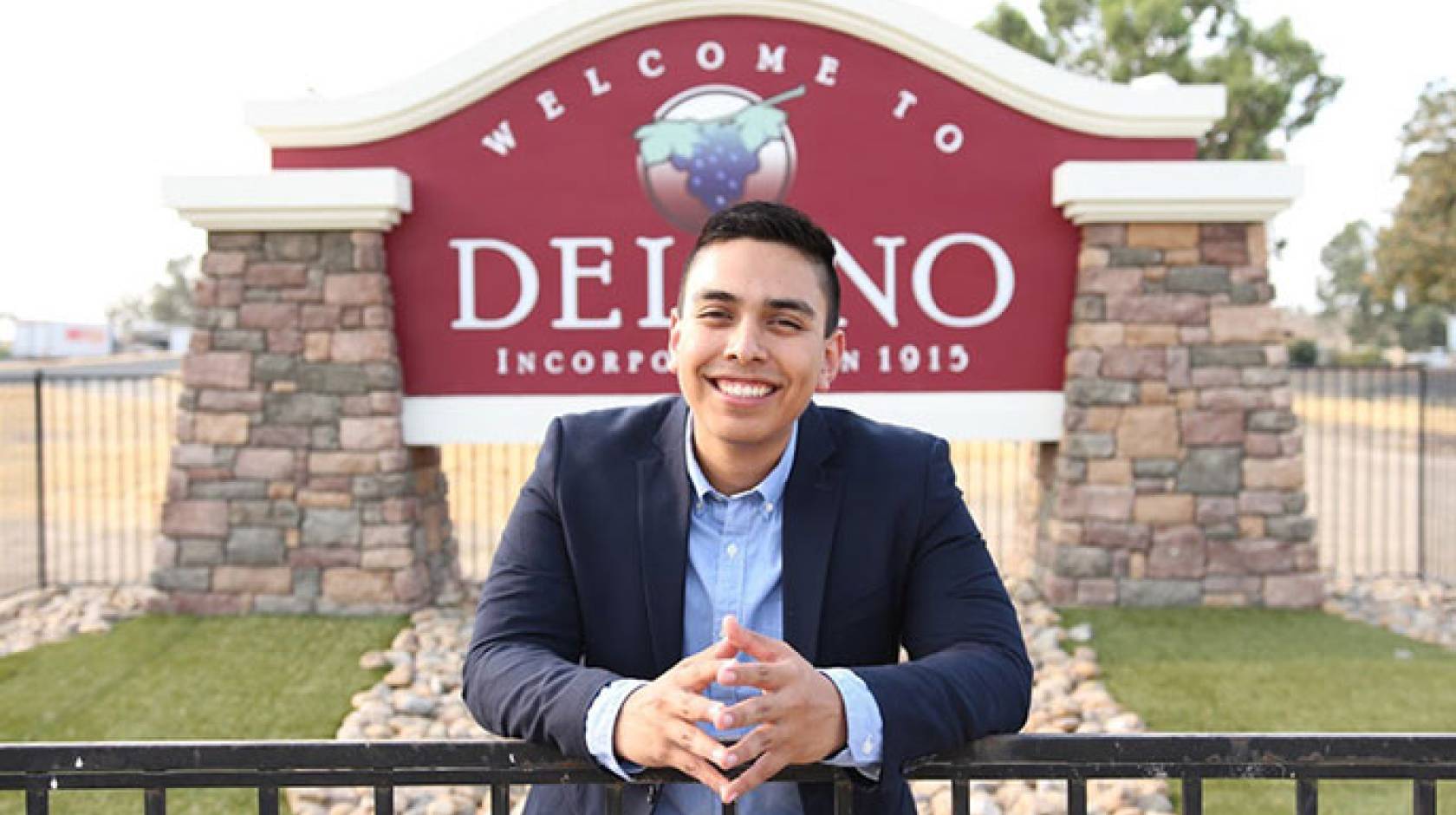 Bryan Osorio Trujillo in front of Delano sign