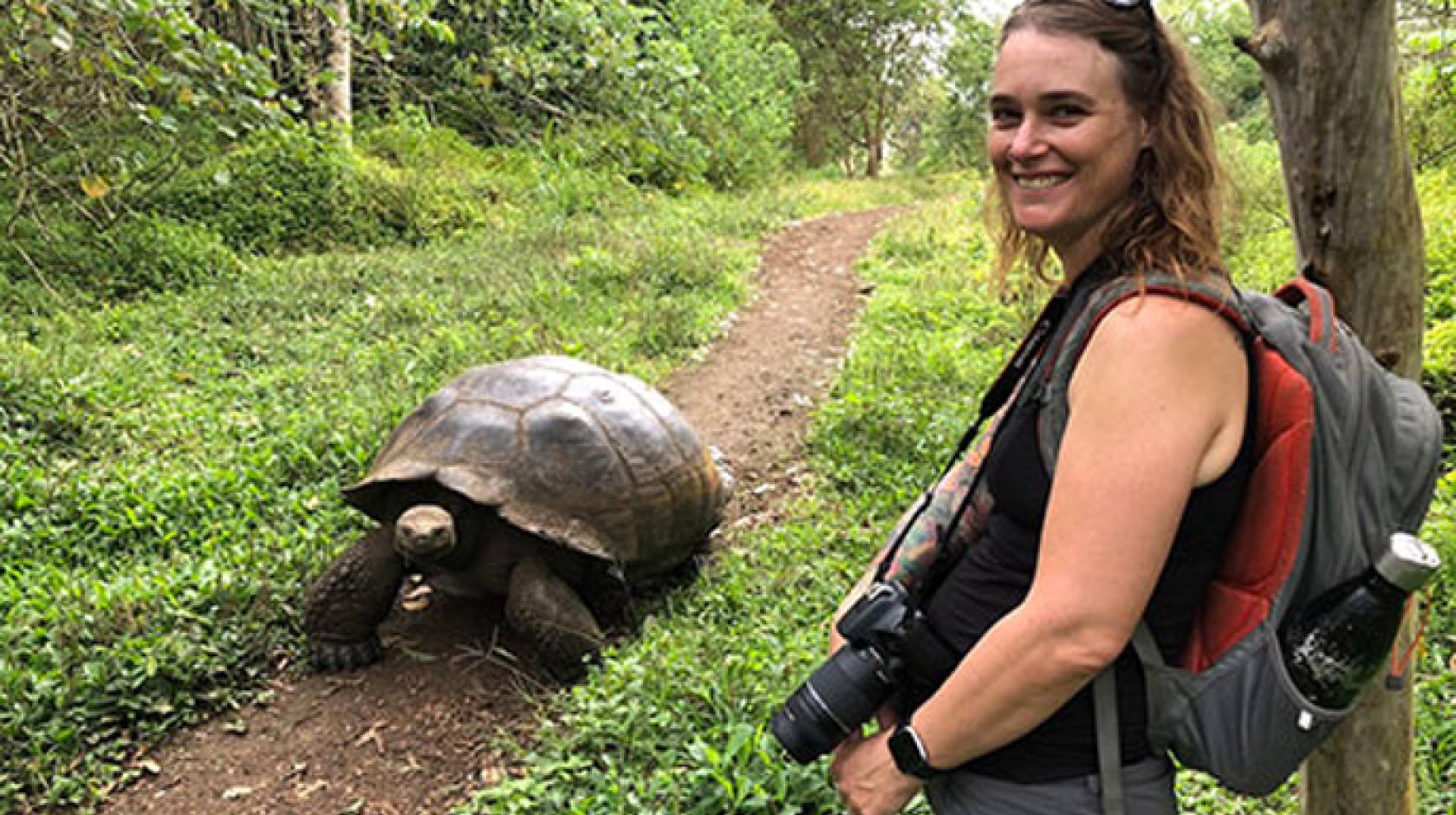 Professor Danielle Edwards with a tortoise on Galapagos