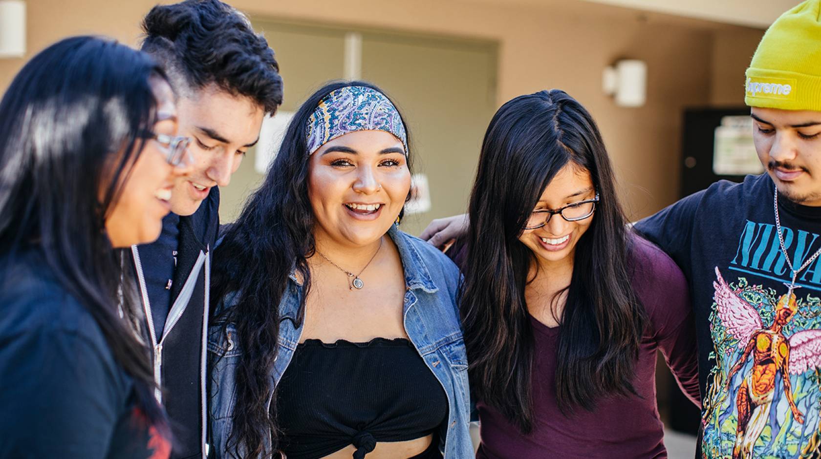 a group of students linking arms