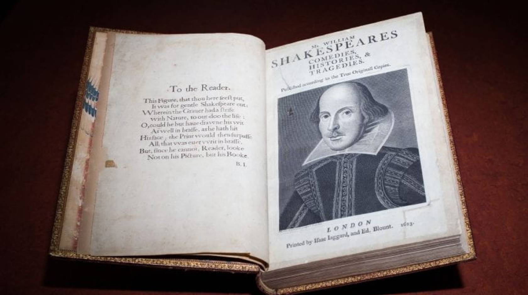 First Folio collection of Shakespeare plays with text on the left page and a portrait of Shakespeare on the right