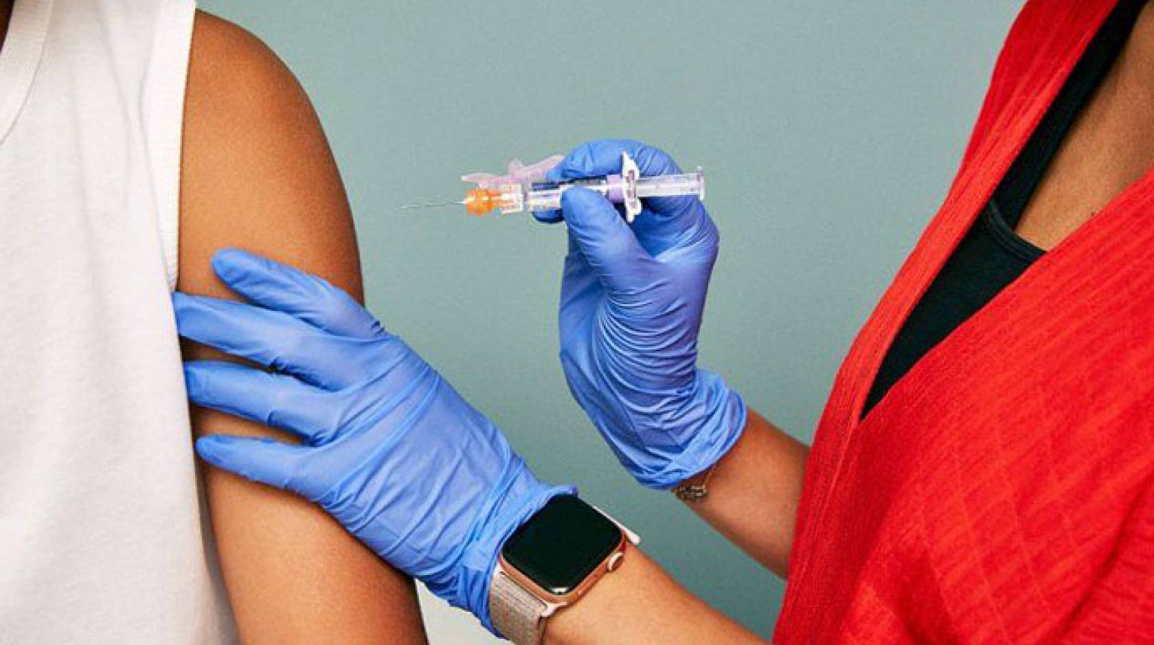 Nurse giving a flu shot to someone