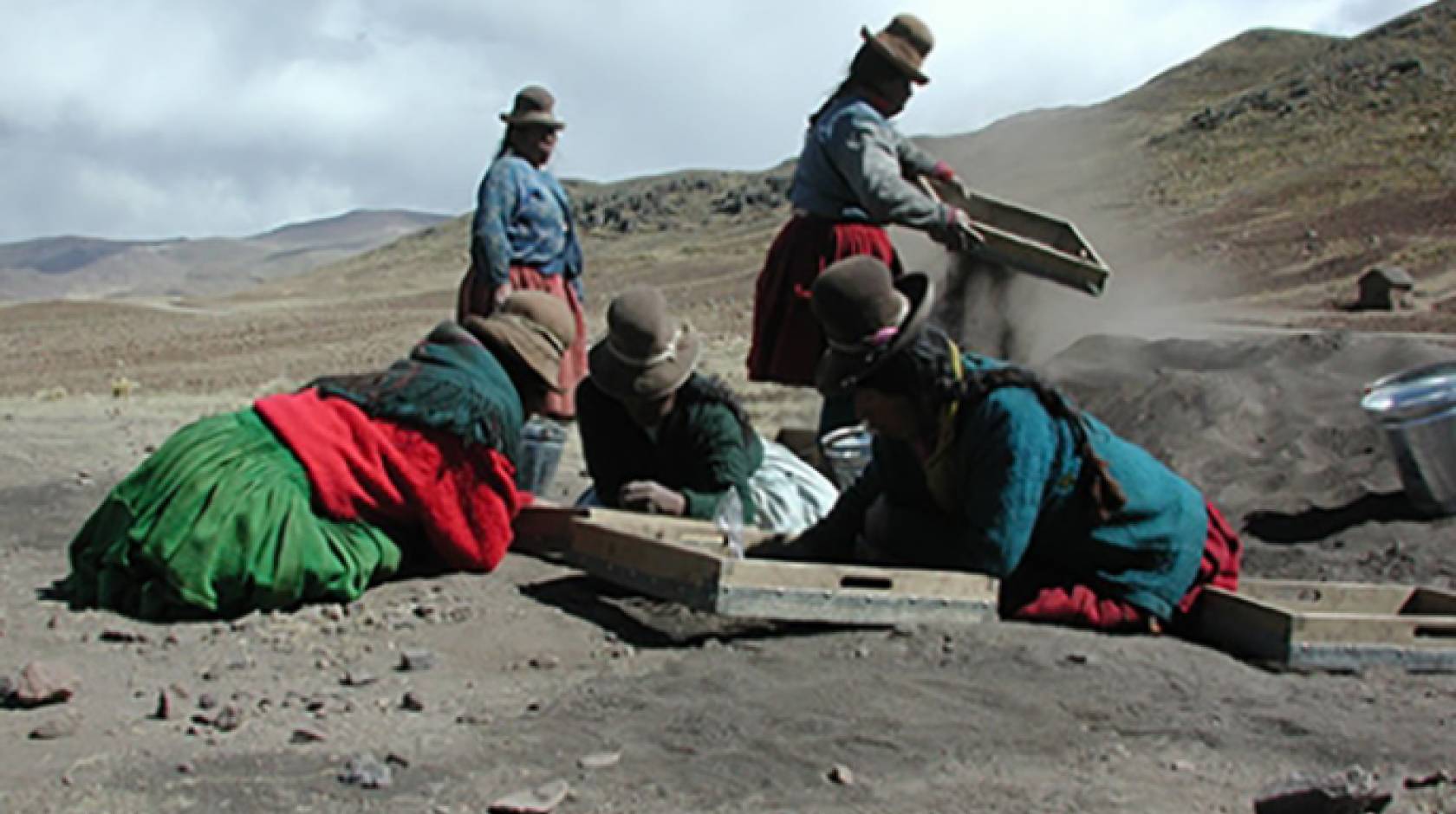 A group of communeros, or villagers, from Jachacachi, Peru, help excavate the site where evidence of potato domestication was found.
