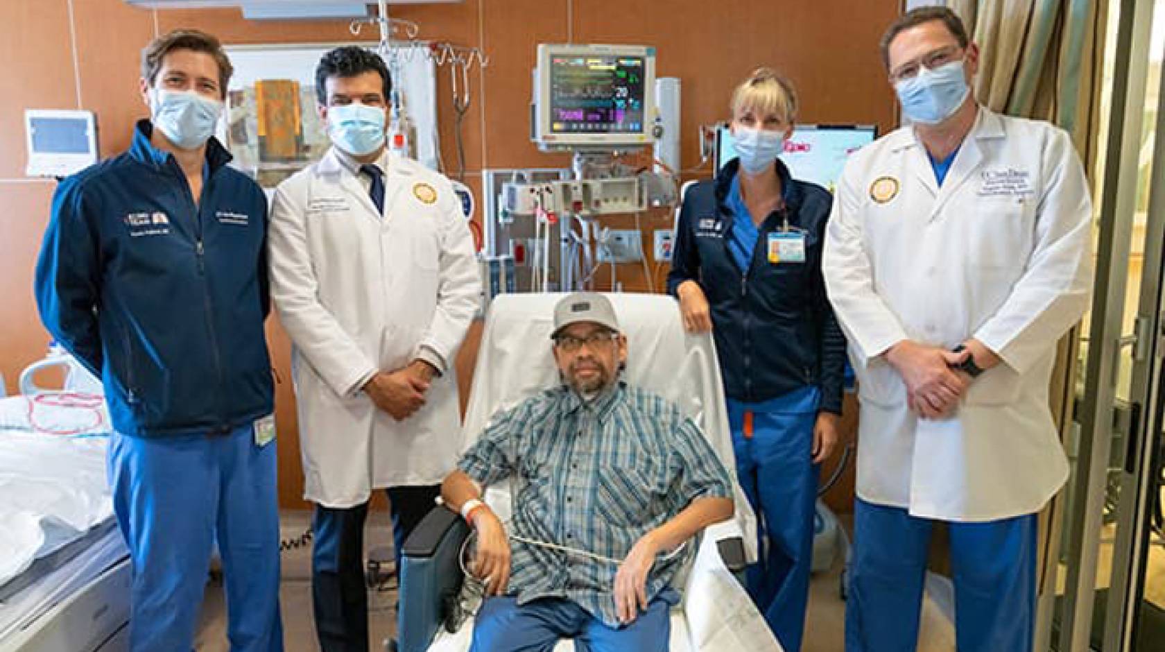 Gomez Gil in hospital with UC San Diego Health team