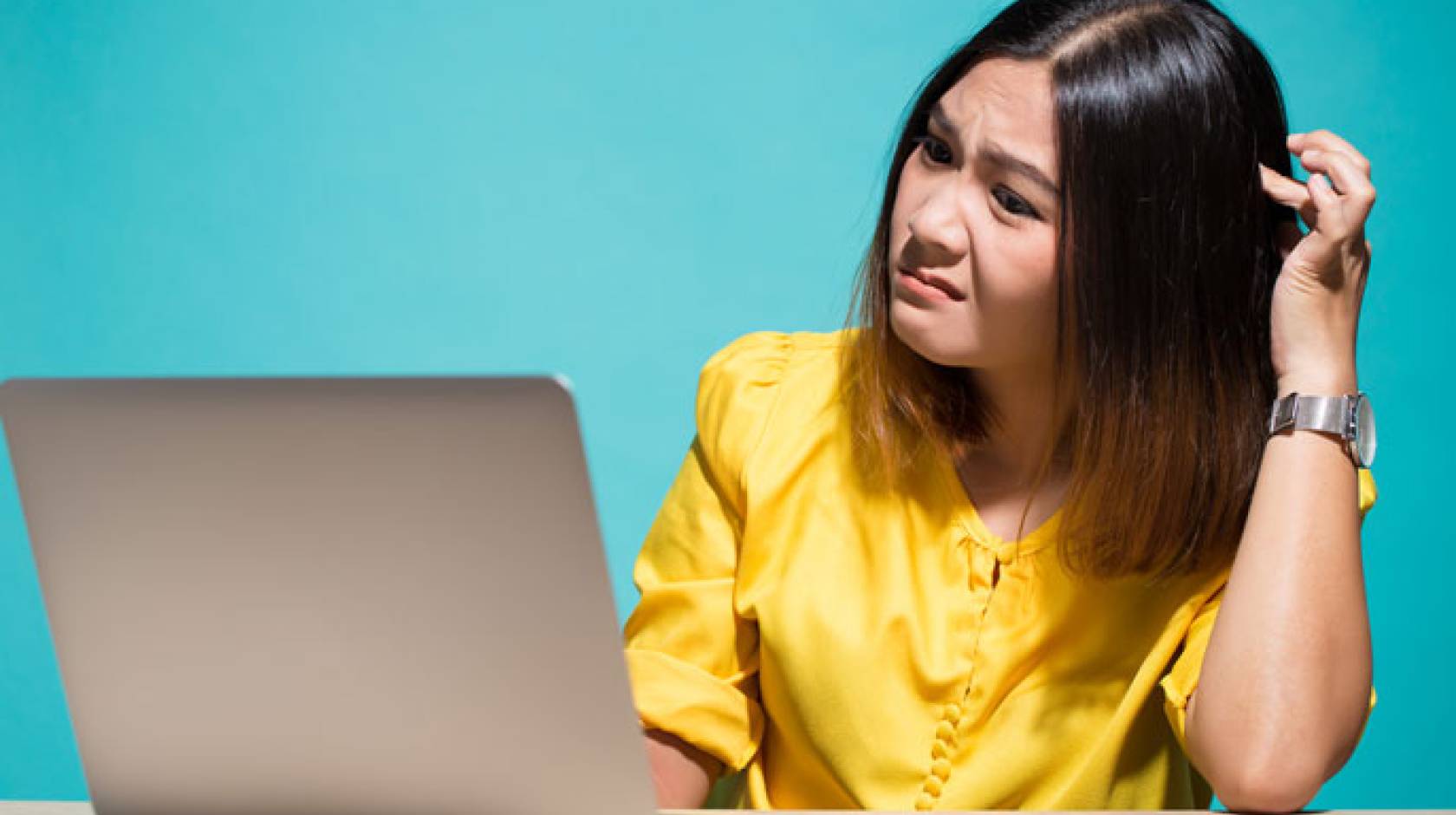 Woman reading fake news on her laptop