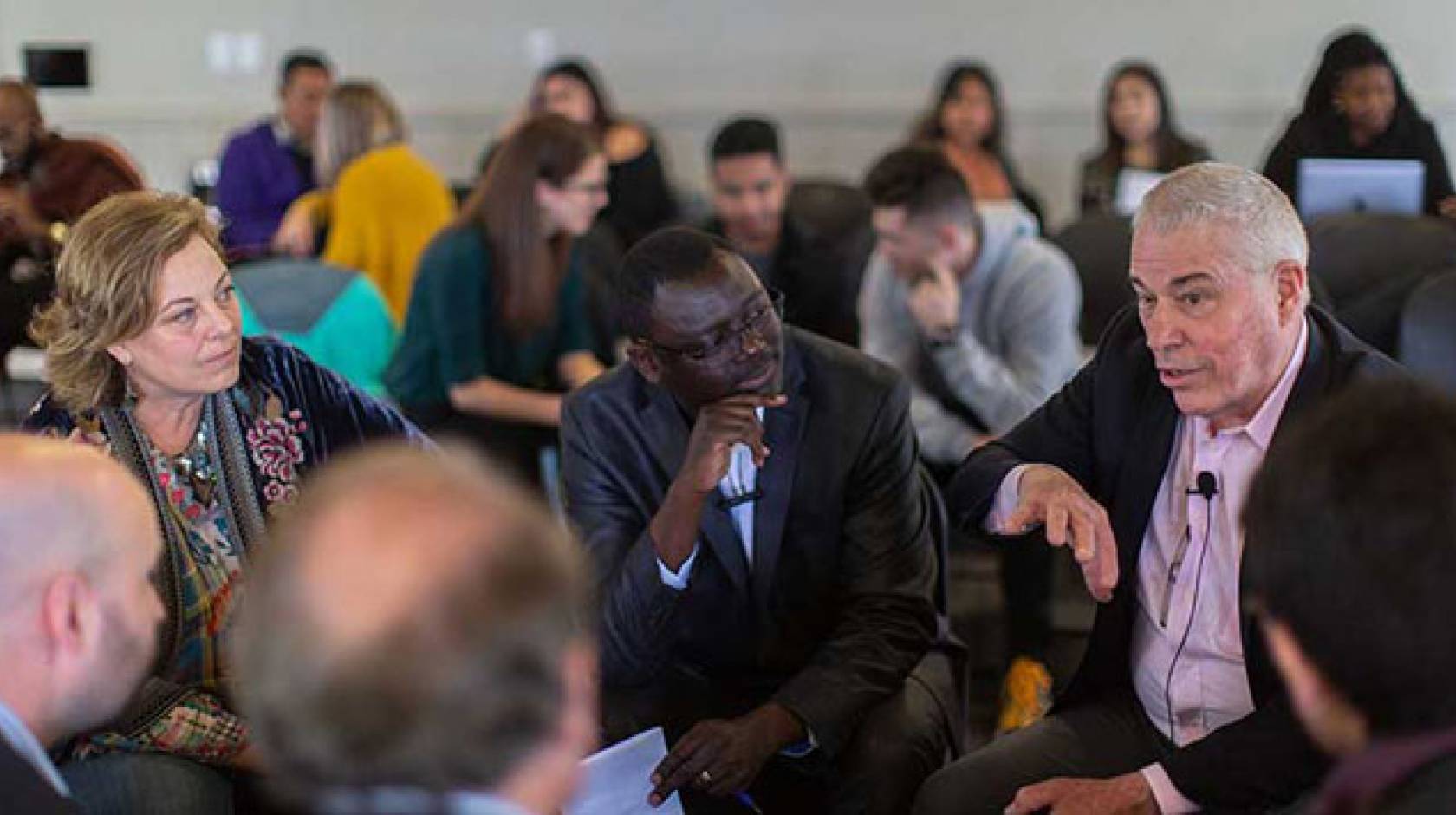 Three people in a workshop circle