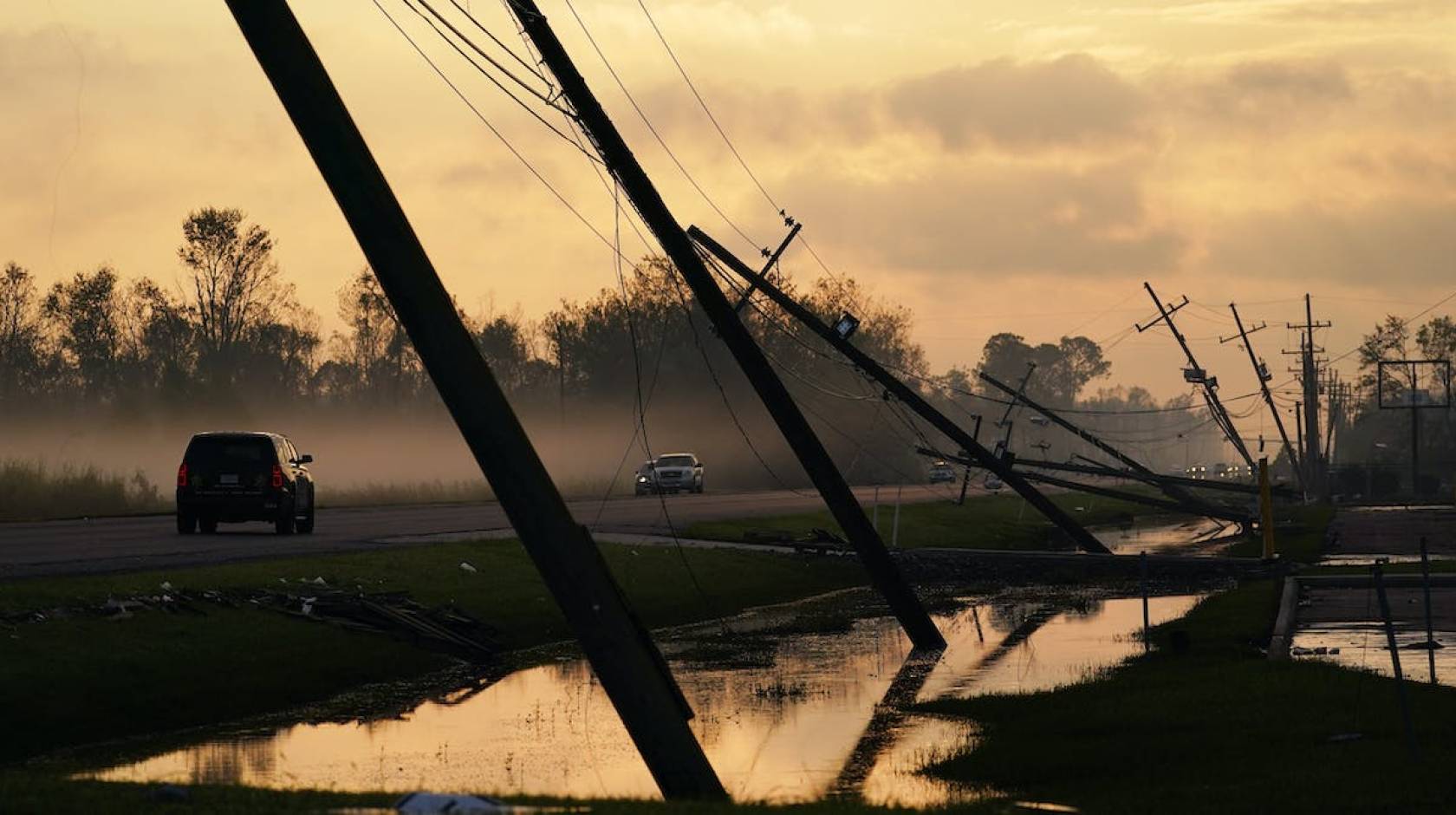 Downed powerlines off a flooded highway