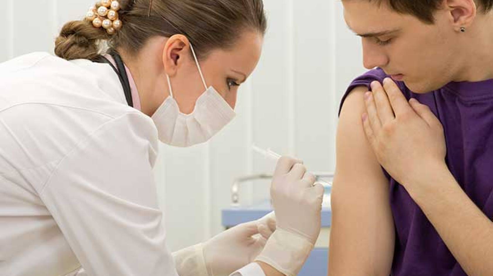 patient gets immunization shot