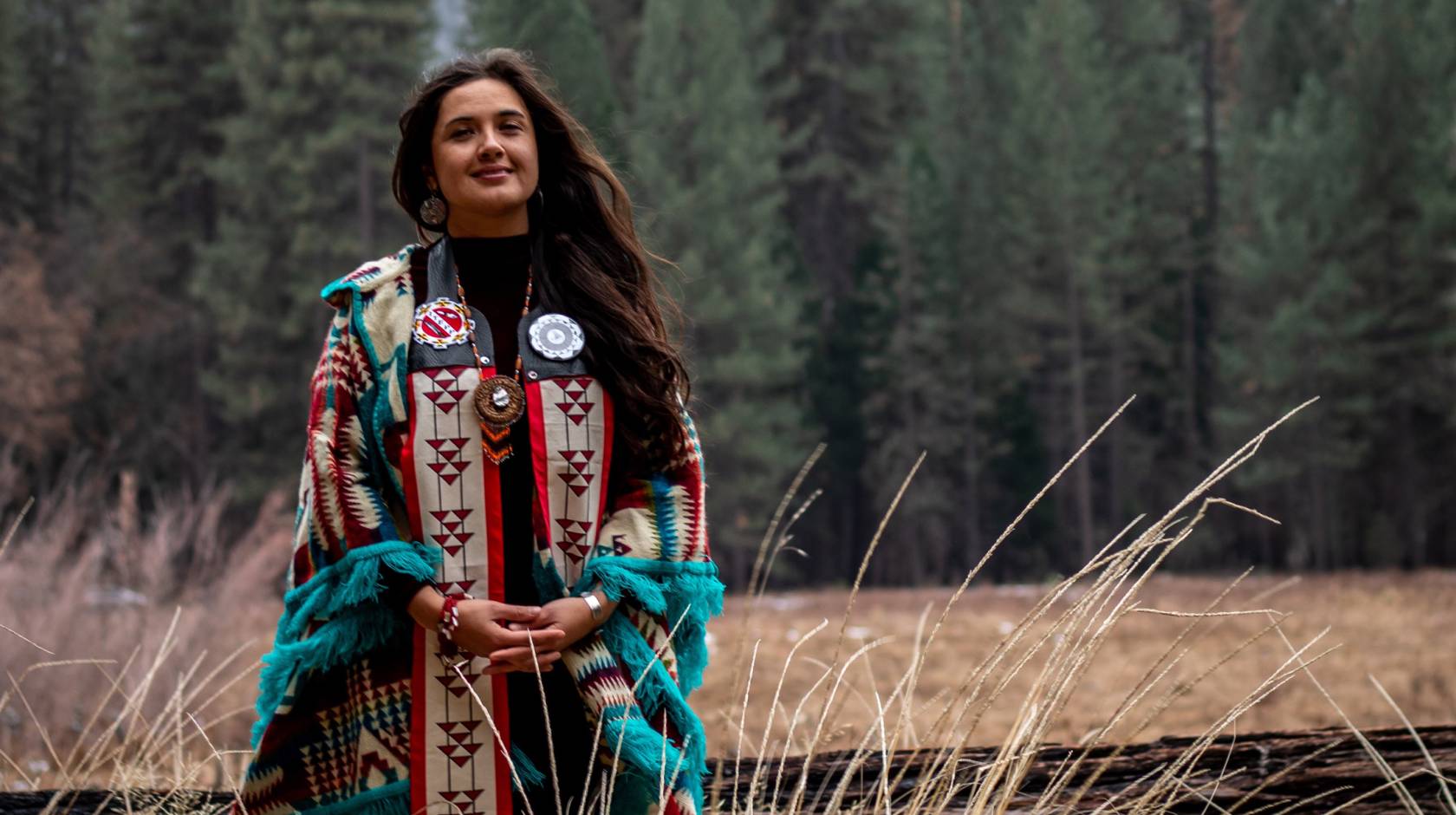 Irene Vasquez at Yosemite in traditional tribal clothing