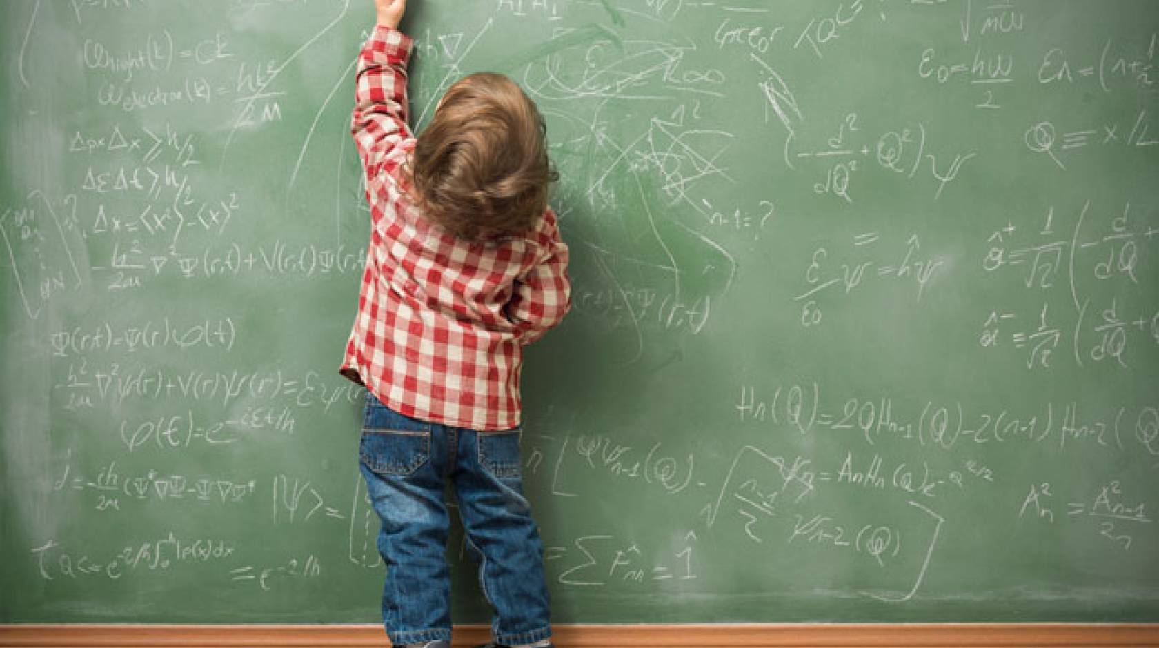 Left-handed child at blackboard