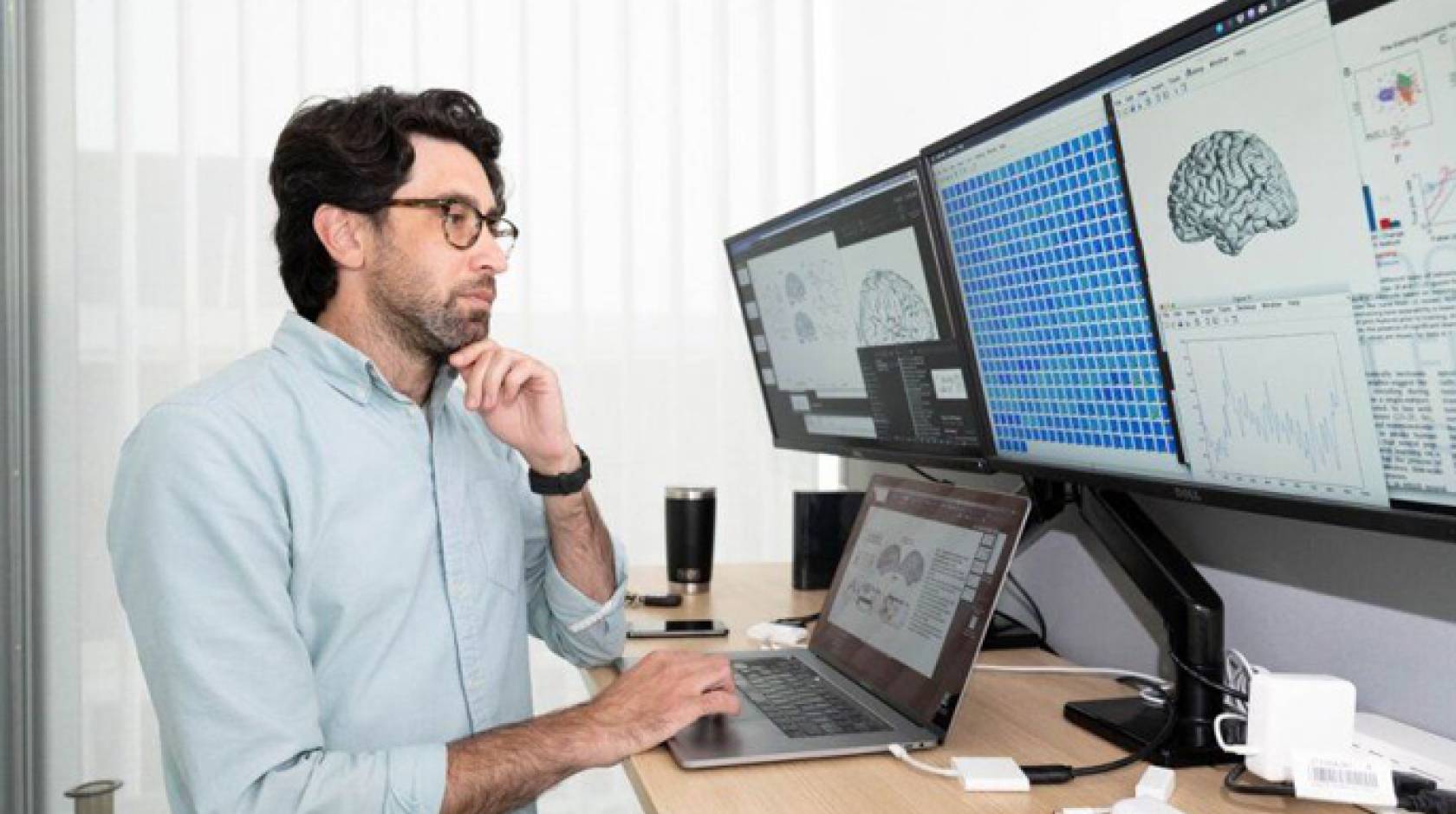 Matt Leonard looking at computer screens