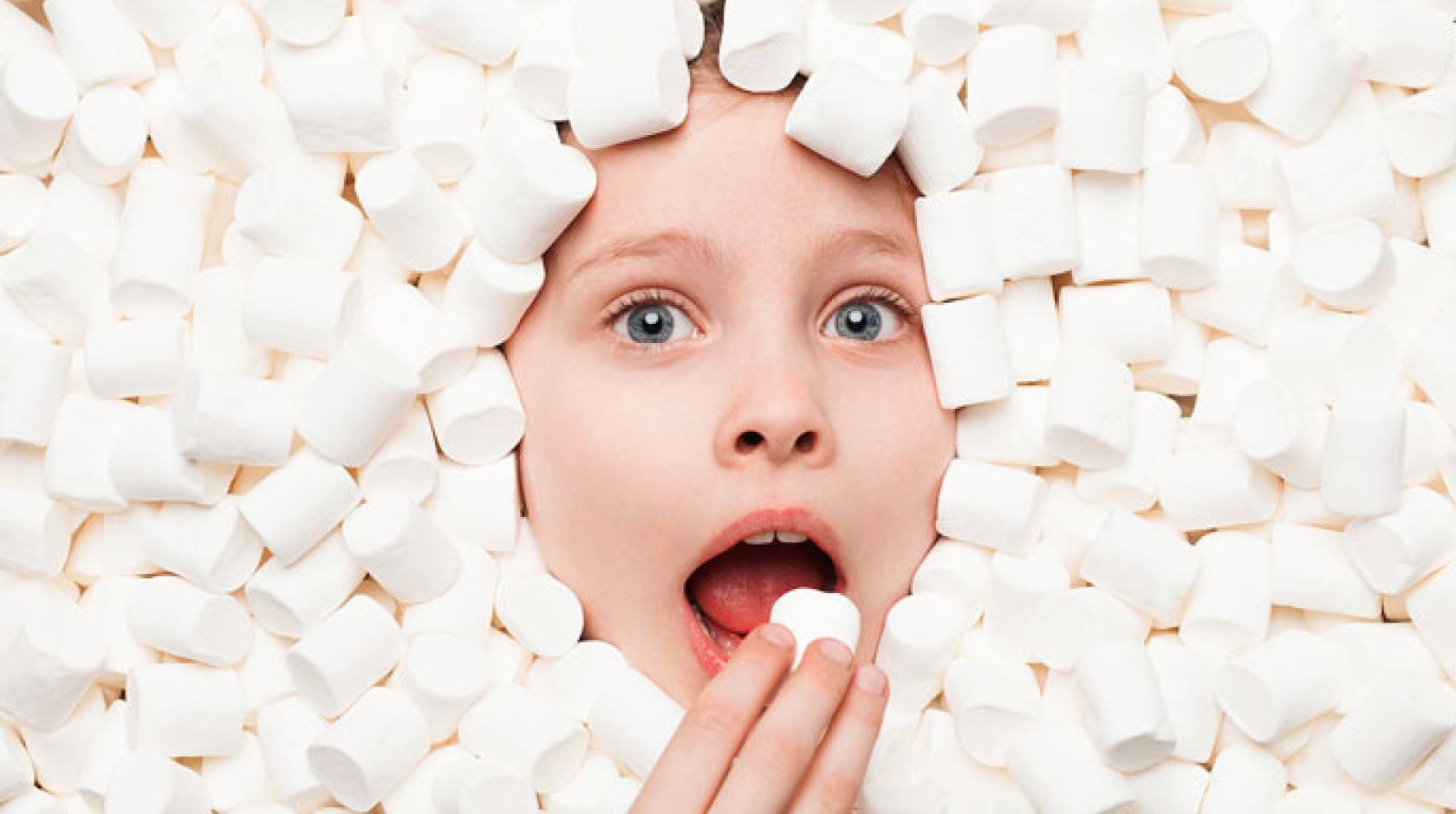 Boy in a pile of marshmallows