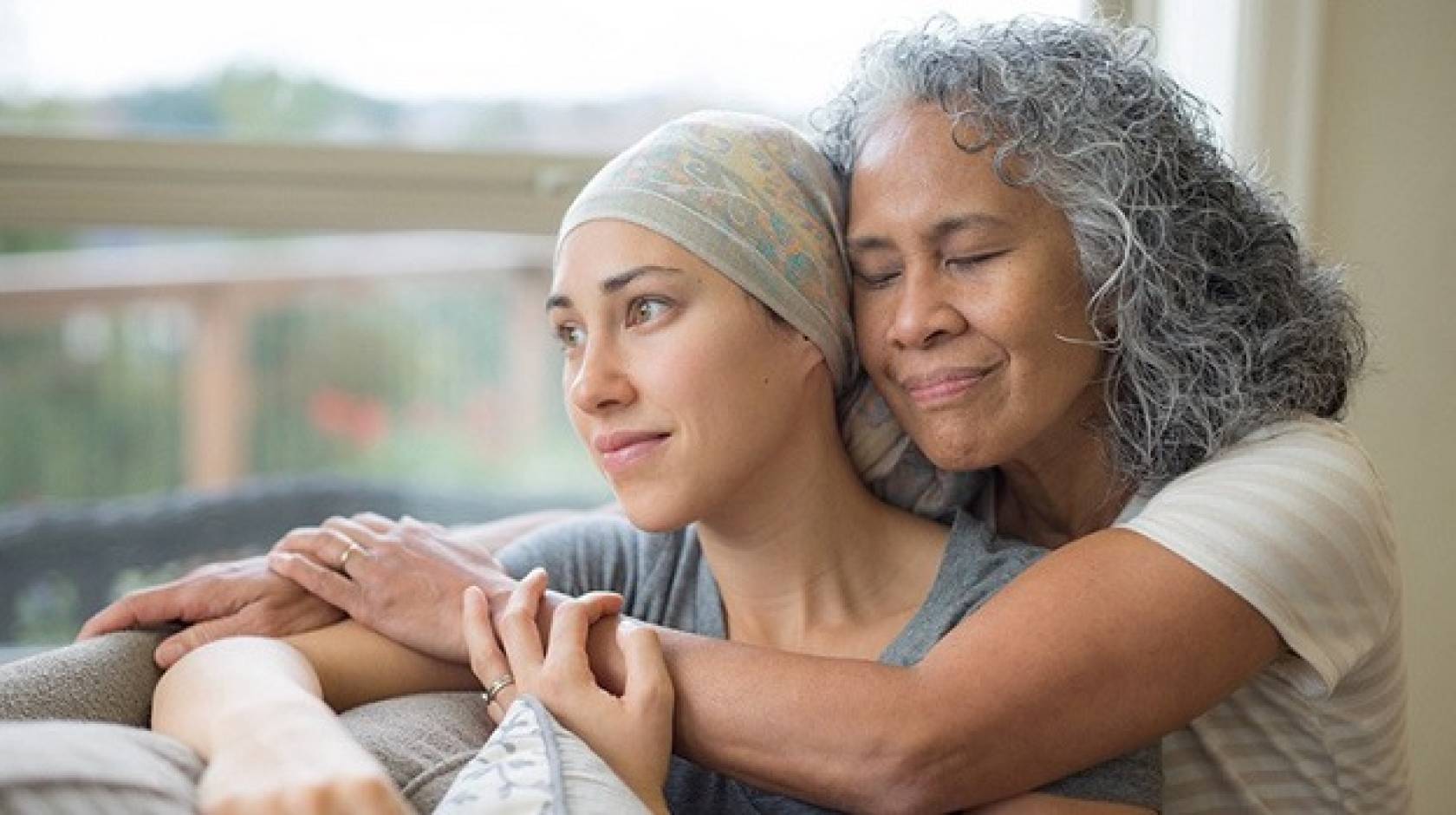 A woman holds her friend