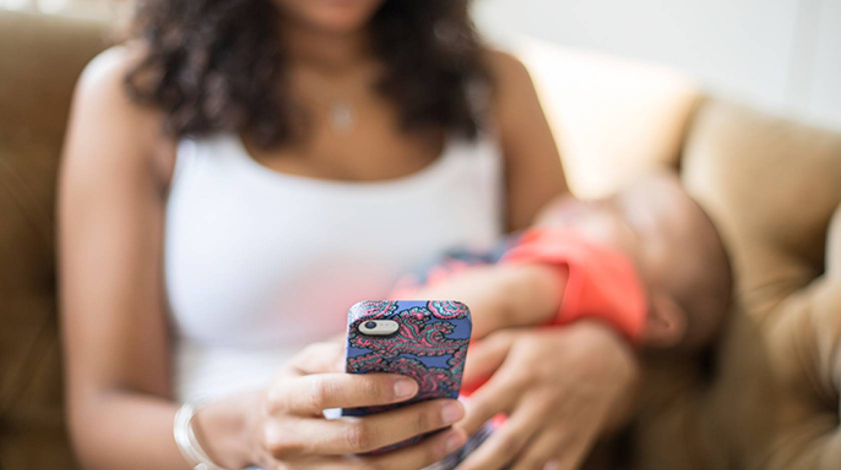 Mother with baby and cellphone