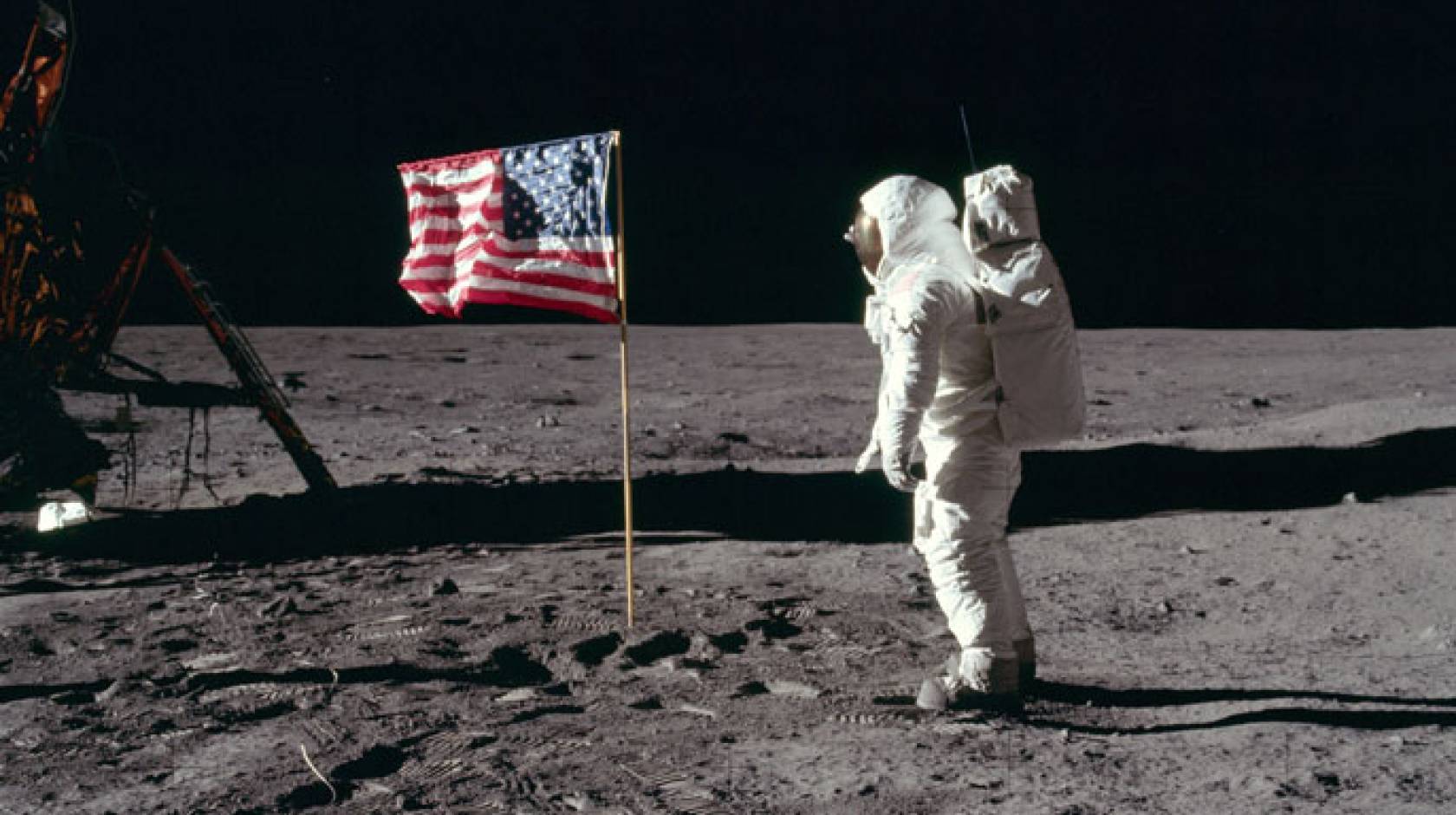 Buzz Aldrin salutes the U.S. flag